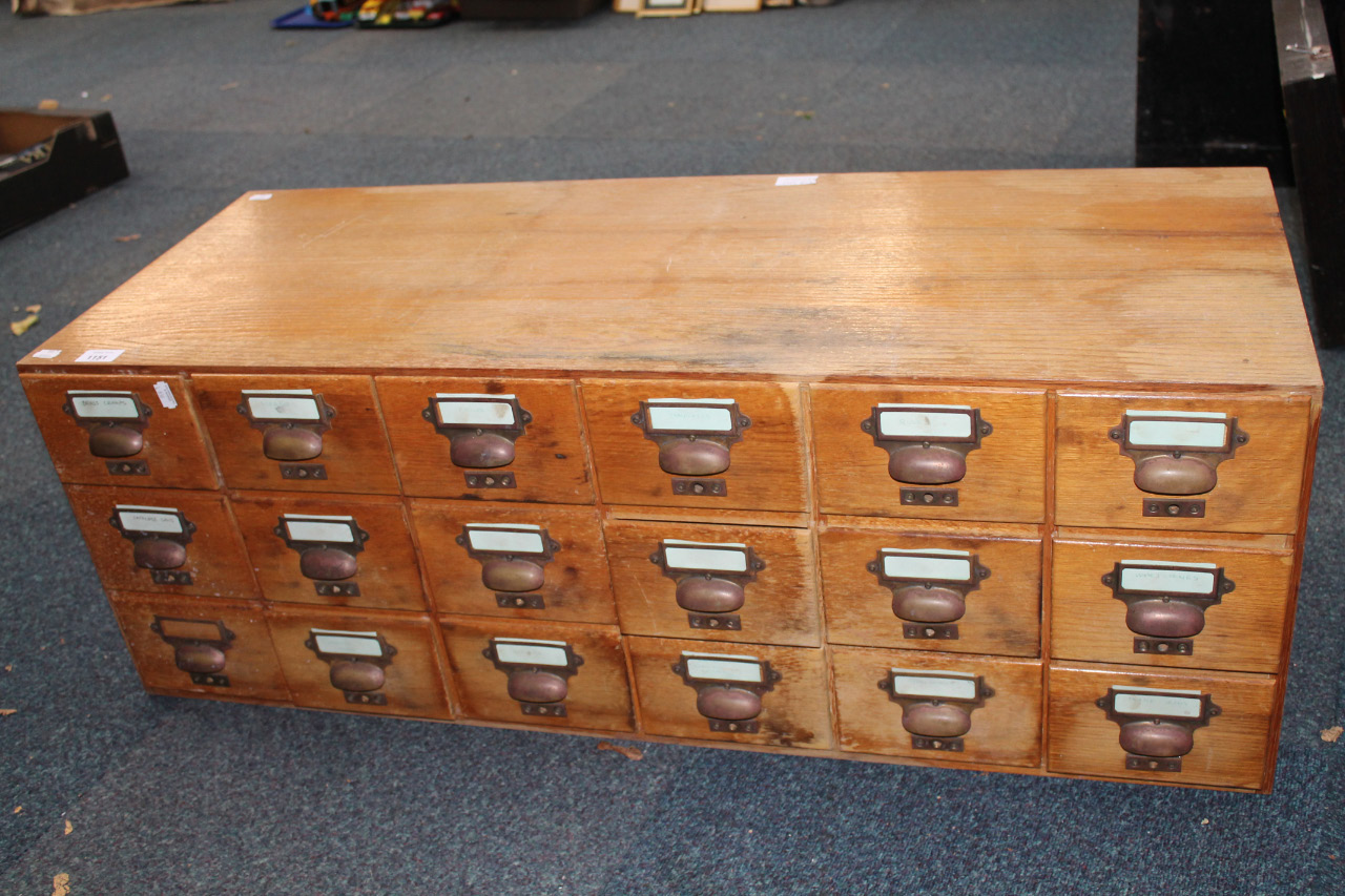 Appraisal: An drawer oak veneer unit containing a collection of tools