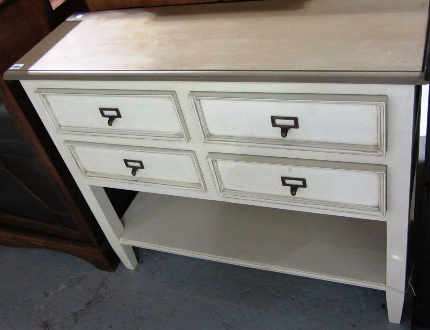 Appraisal: A th century cream and brown painted four drawer side