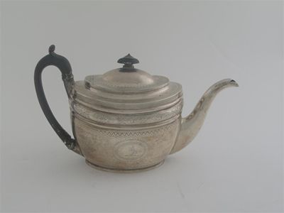 Appraisal: A George III oval teapot with moulded friezes and bright-cutting