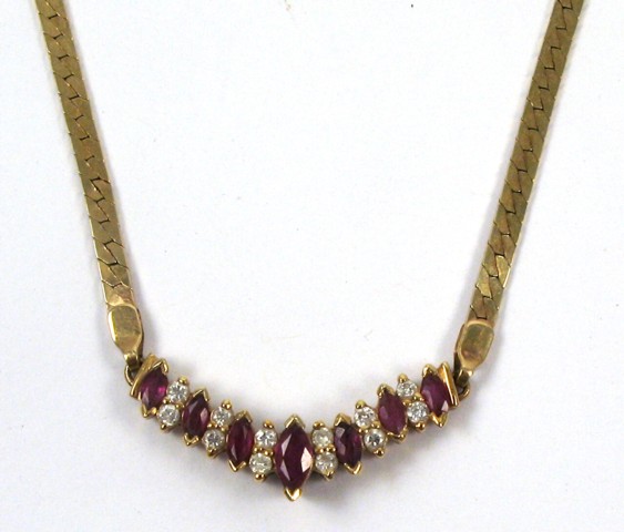 Appraisal: RUBY AND DIAMOND PENDANT NECKLACE k yellow gold The pendant