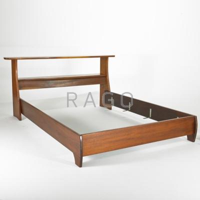 Appraisal: PAUL STRUM Sculpted walnut queen-sized headboard and bed frame Incised