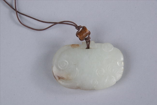 Appraisal: CHINESE WHITE JADE PENDANT Qing Dynasty Carved to depict tiger