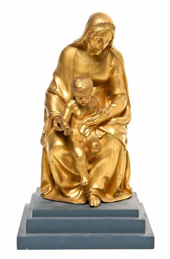 Appraisal: A Continental Gilt Bronze Figural Mount depicting a seated Madonna