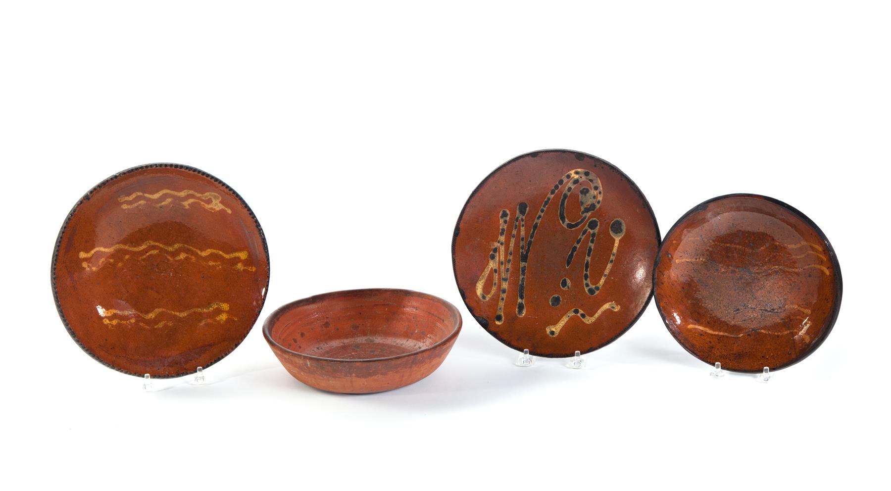 Appraisal: FOUR AMERICAN REDWARE DISHES Second half- th century Three pie