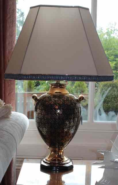 Appraisal: A DARK BLUE GROUND AND GILT POTTERY TABLE LAMP in