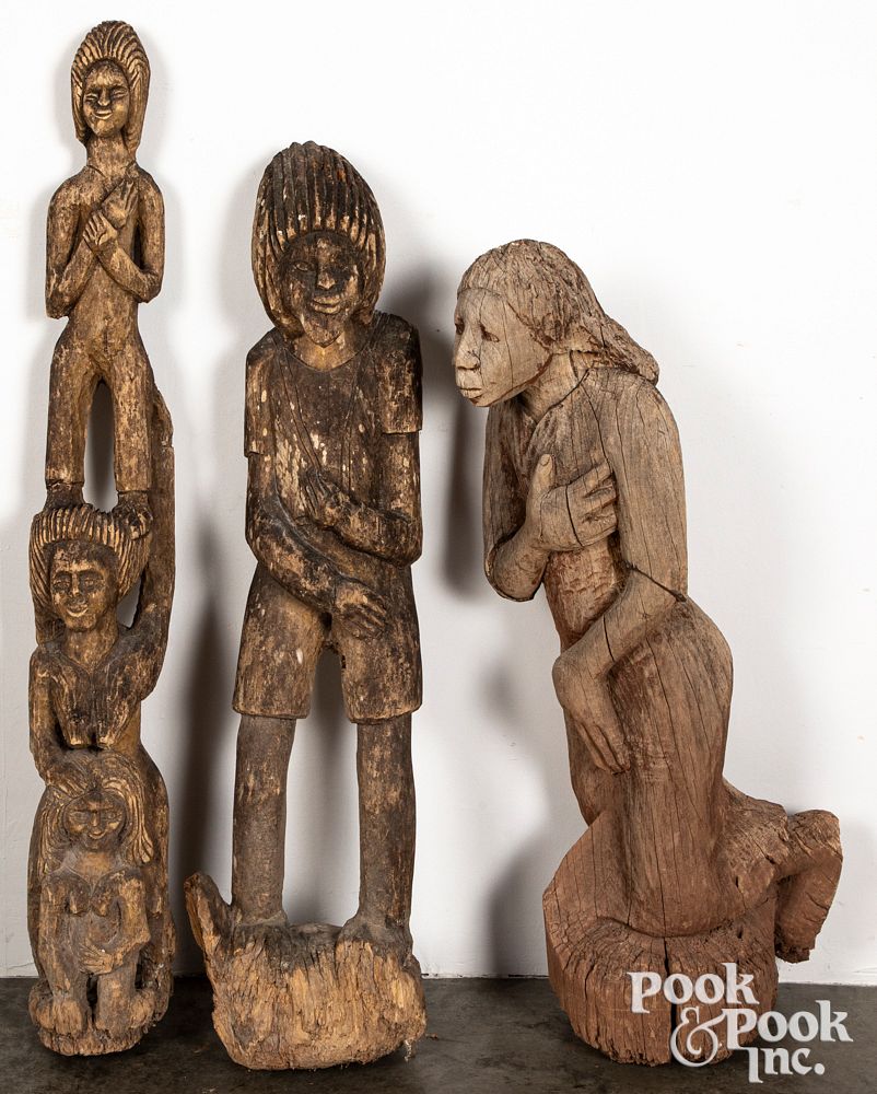 Appraisal: Three Jamaican carved wood statues Three Jamaican carved wood statues