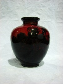 Appraisal: A Royal Doulton Flambe vase of ovoid form enriched with