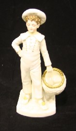 Appraisal: A royal Worcester figure of a boy in a sailors