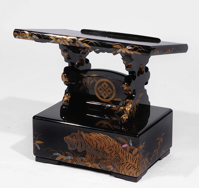 Appraisal: A Japanese black lacquer reading standMeiji periodwith gilt tiger design