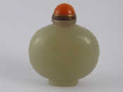 Appraisal: A Chinese polished flattened ovoid jade snuff bottle ht cm