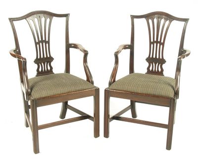 Appraisal: A pair of George III mahogany open armchairs with pierced