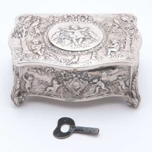 Appraisal: Silver automotion music box ca Rectangular form decorated with putti