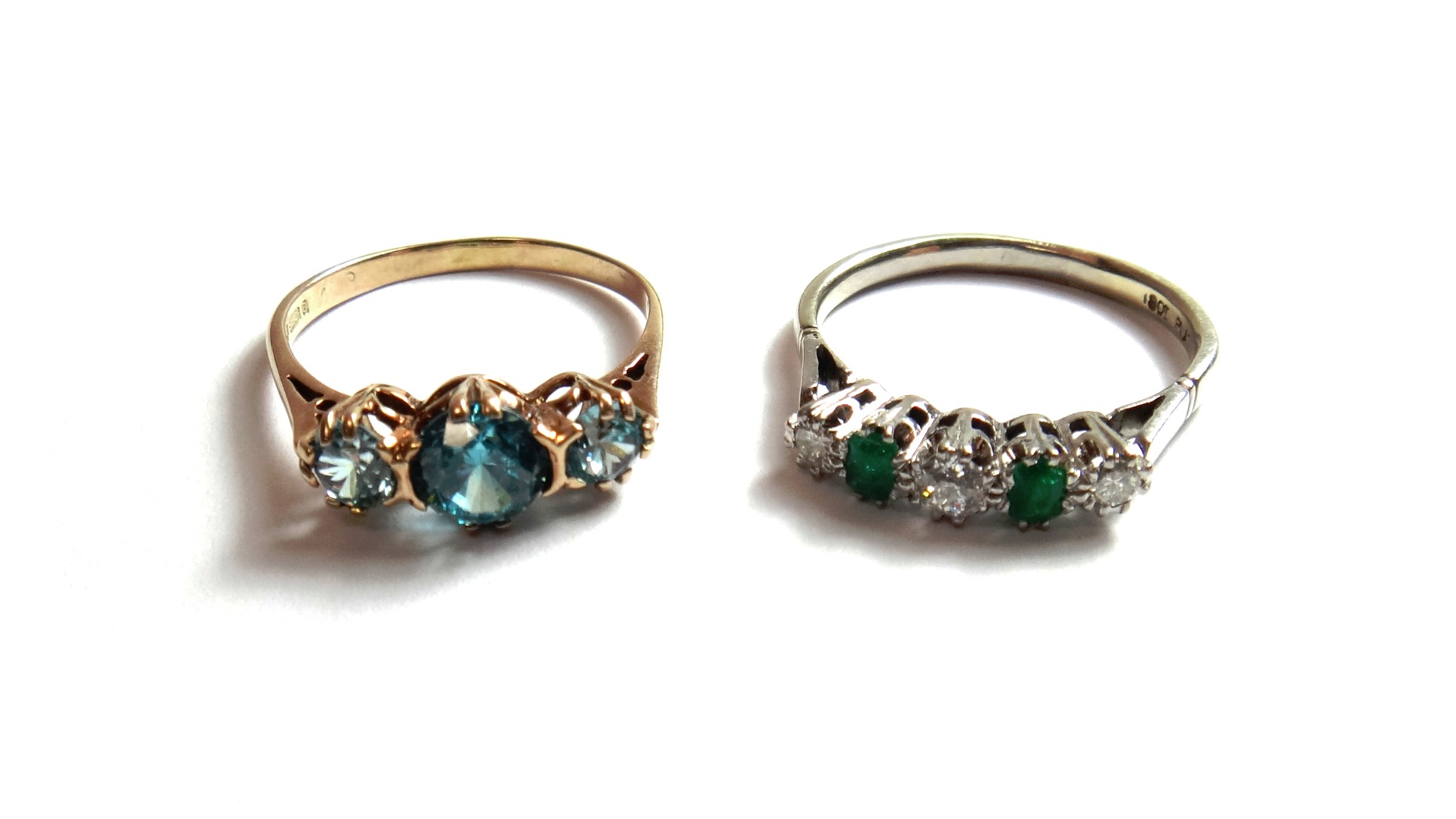 Appraisal: A white gold and platinum diamond and emerald set five