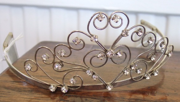 Appraisal: A silvered metal and colourless paste set tiara of Belle