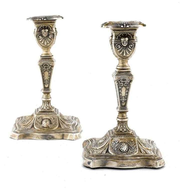 Appraisal: A PAIR OF VICTORIAN DWARF CANDLESTICKS the nozzle in square