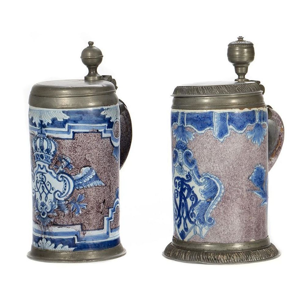 Appraisal: German Ceramic Pewter Steins Two similar barrel form decorated with