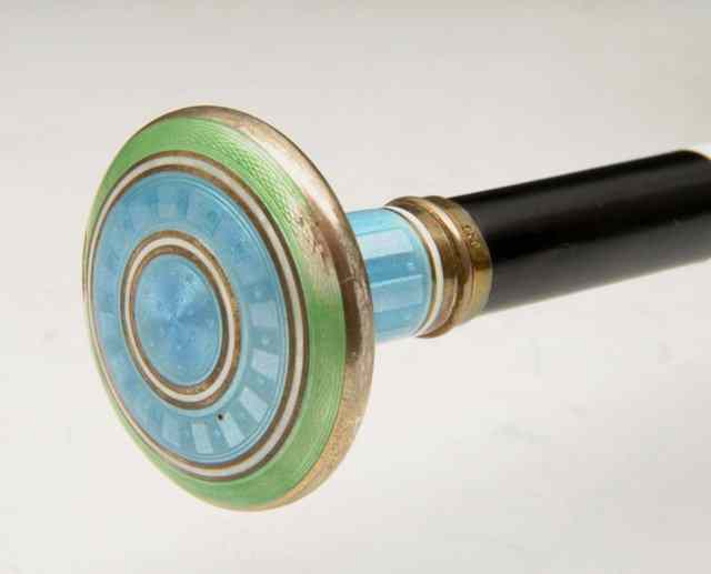 Appraisal: A WALKING CANE WITH WHITE METAL FINIAL with blue and