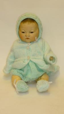 Appraisal: An Armand Marseille bisque head Oriental baby doll with brown