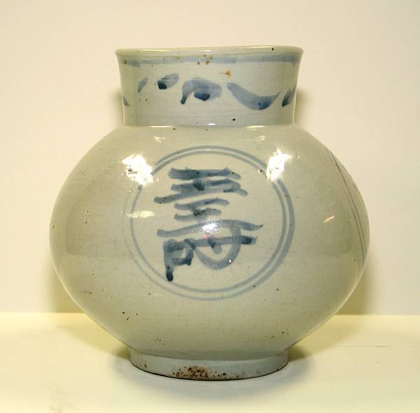 Appraisal: A blue and white glazed pottery jar The gently flared