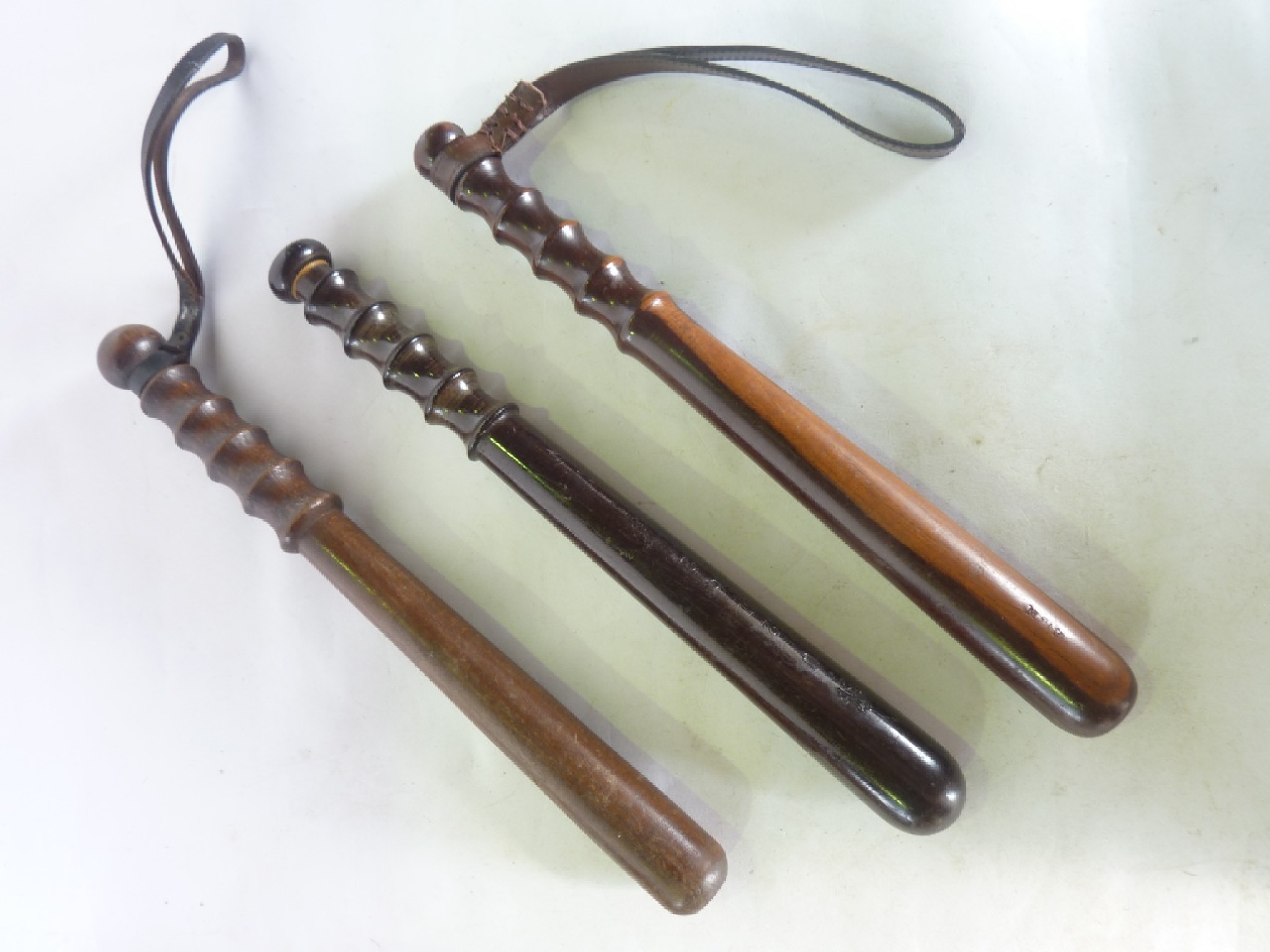 Appraisal: A trio of polished timber truncheons