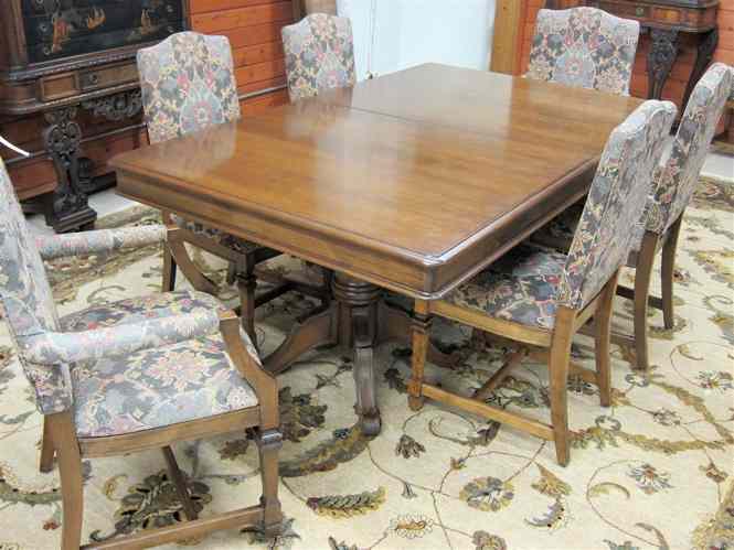 Appraisal: WALNUT AND MAHOGANY DINING TABLE AND CHAIR SET American mid-