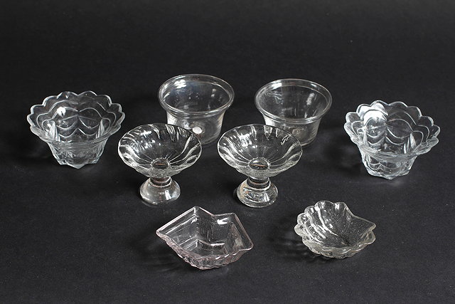 Appraisal: A PAIR OF ANTIQUE GLASS PATTY PANS with folded rims