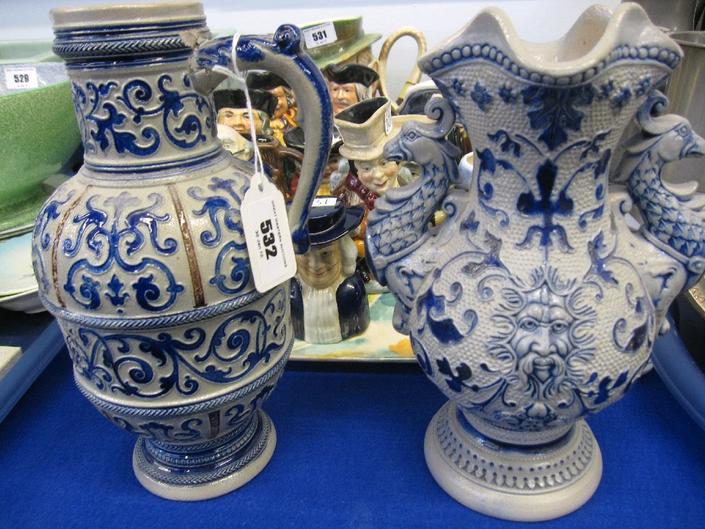 Appraisal: Lot comprising two German stoneware jugs each decorated with blue