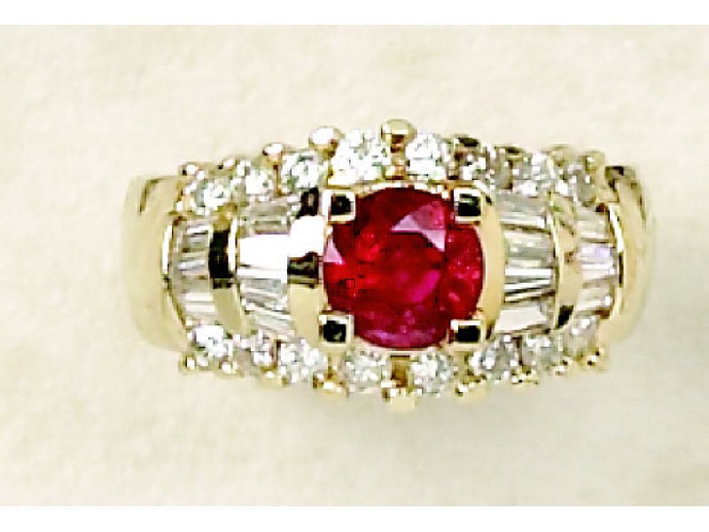 Appraisal: DIAMOND AND RUBY RING k yellow gold lady's ring centering