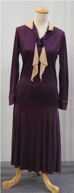 Appraisal: Cocktail dress in plum toned rayon with cream detail to