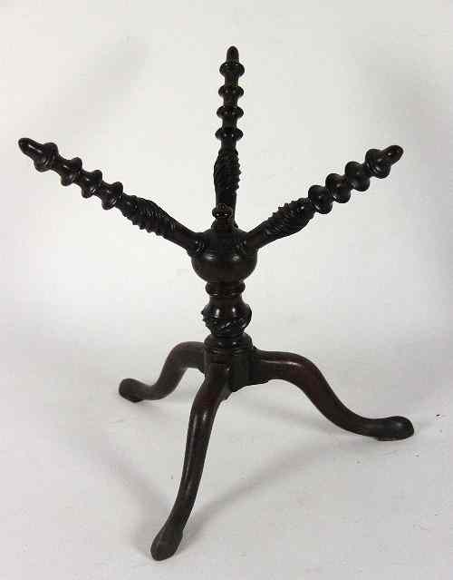 Appraisal: An th Century mahogany cat trivet with three spindle turned