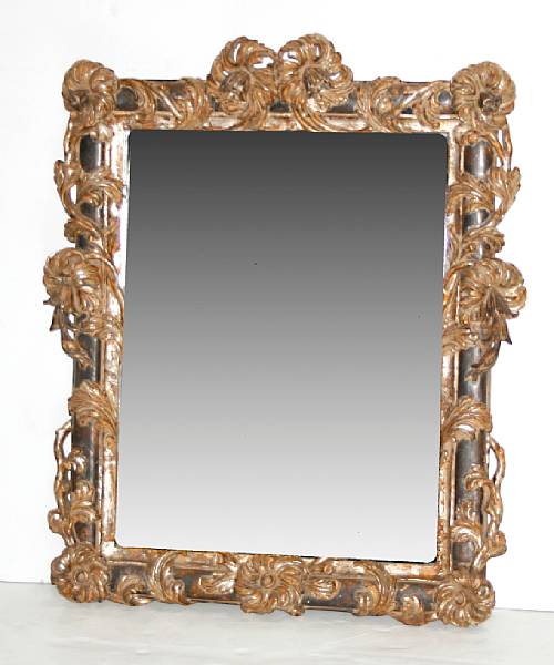 Appraisal: A Baroque style carved painted and giltwood beveled glass mirror