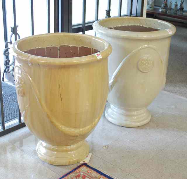 Appraisal: A LARGE PAIR OF POTTERY PLANTERS a matching pair with