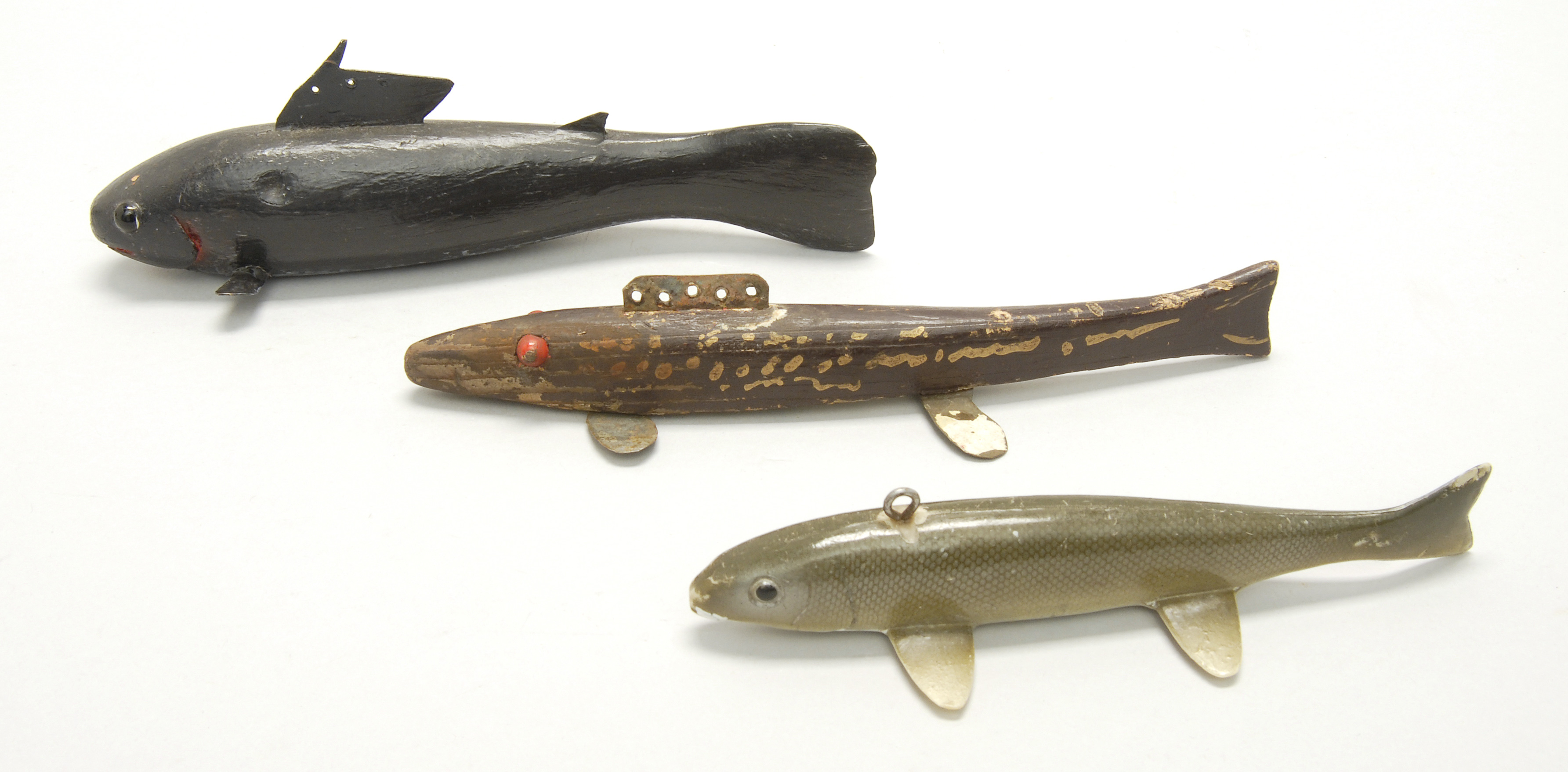 Appraisal: THREE FISH DECOYS th CenturyGlass tack or painted eyes Lengths