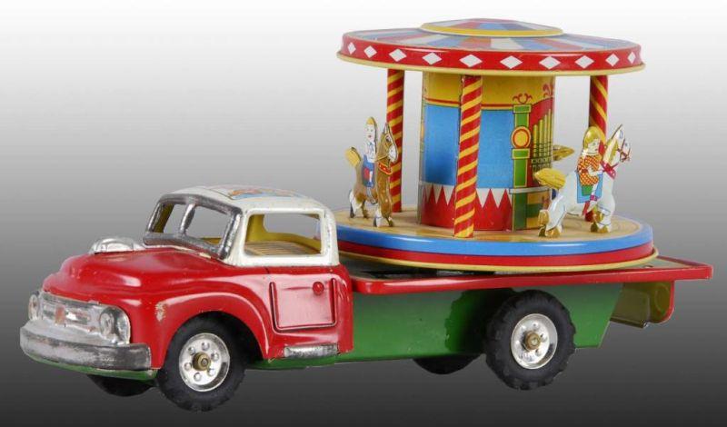 Appraisal: Japanese Merry-Go-Round Toy Truck Description Original box Friction motor When