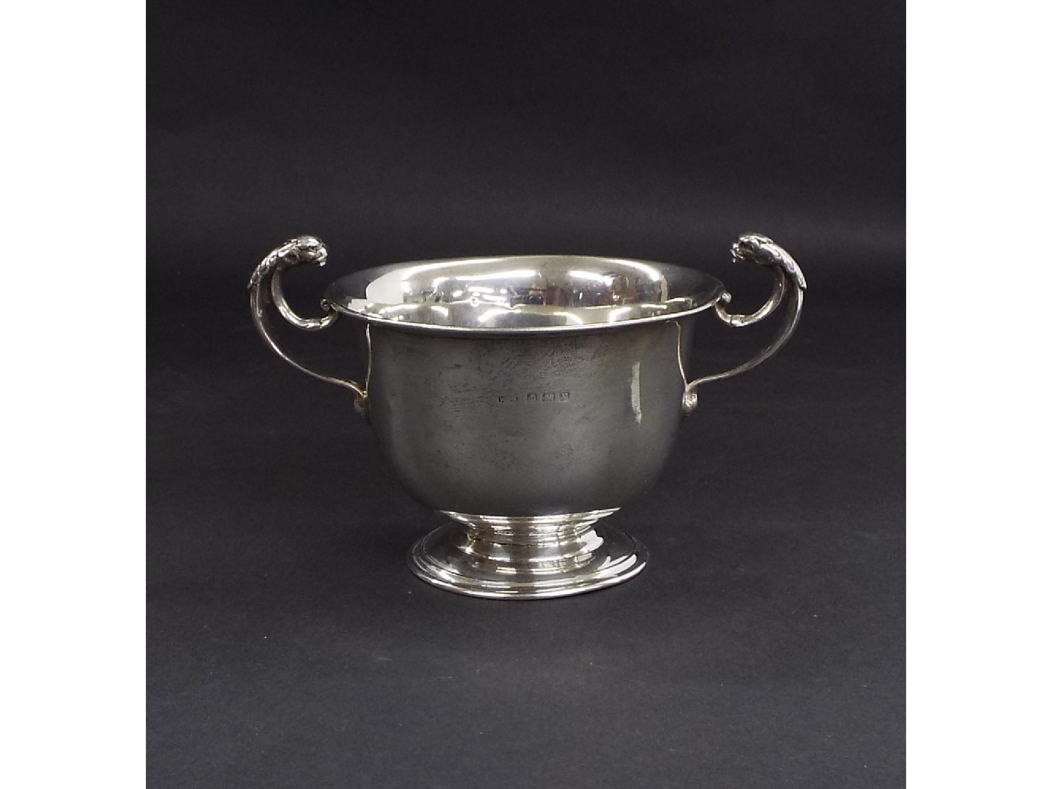 Appraisal: s silver twin handled porringer with cast handles in the