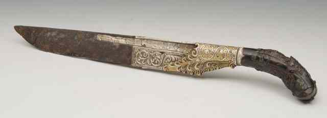 Appraisal: A SINHALESE DAGGER with carved and silver inlaid handle and