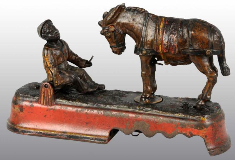 Appraisal: Cast Iron Always Did 'Spise a Mule Mechanical Bank Description