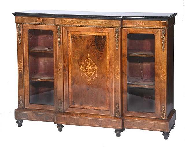 Appraisal: A VICTORIAN WALNUT AND GILT METAL BREAKFRONT SIDE CABINET the