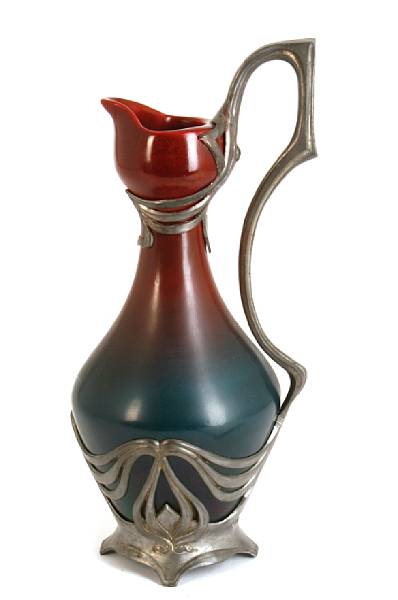 Appraisal: A Jugenstil pewter mounted glazed earthenware pitcher circa repaired restored