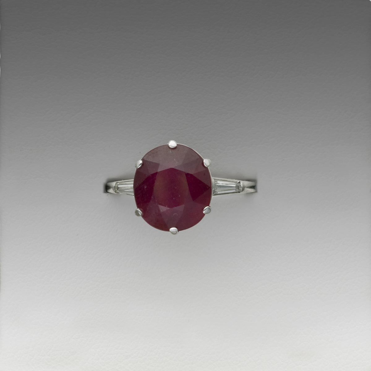 Appraisal: RUBY DIAMOND AND PLATINUM RING The oval-cut ruby measures approximately