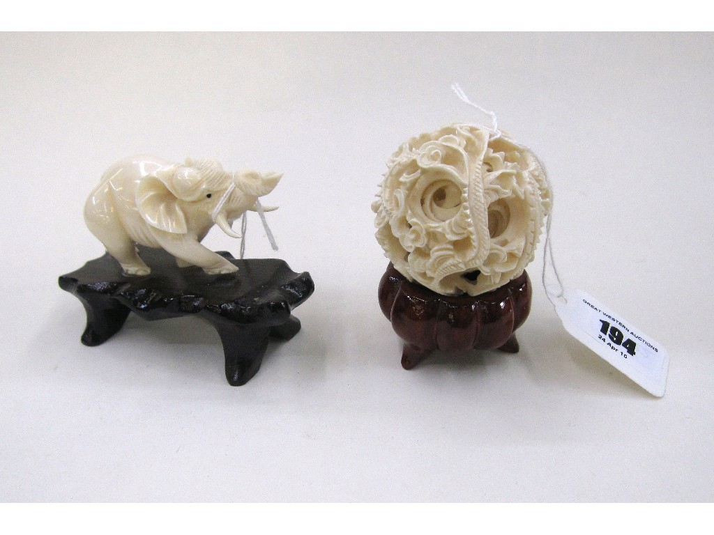 Appraisal: Lot comprising carved ivory puzzle ball and a carved ivory