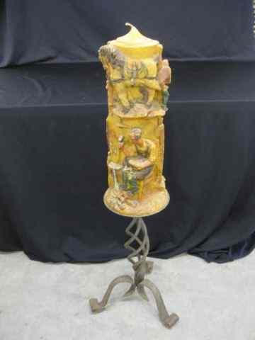 Appraisal: Wrought Iron Candlestand with Carvedcandle blacksmith scene '' overall