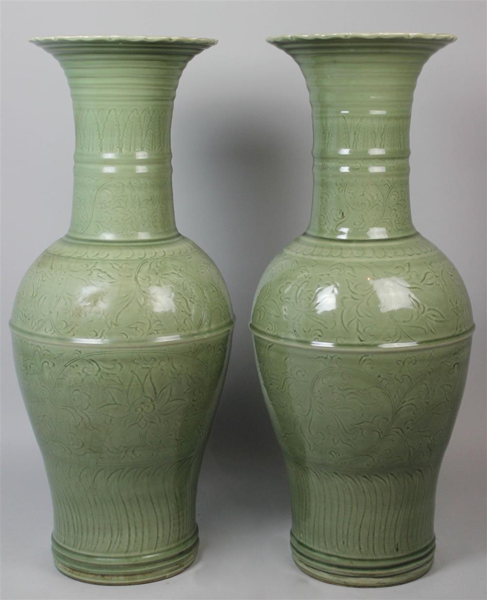 Appraisal: NEAR PAIR OF INCISED CELADON PALACE VASES of baluster form