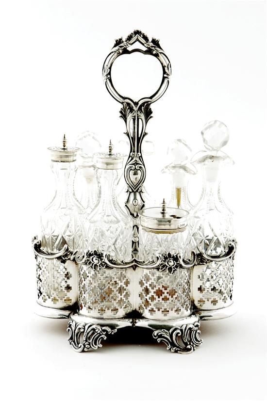 Appraisal: English silverplate and crystal cruet Rococo piercework frame fitted with