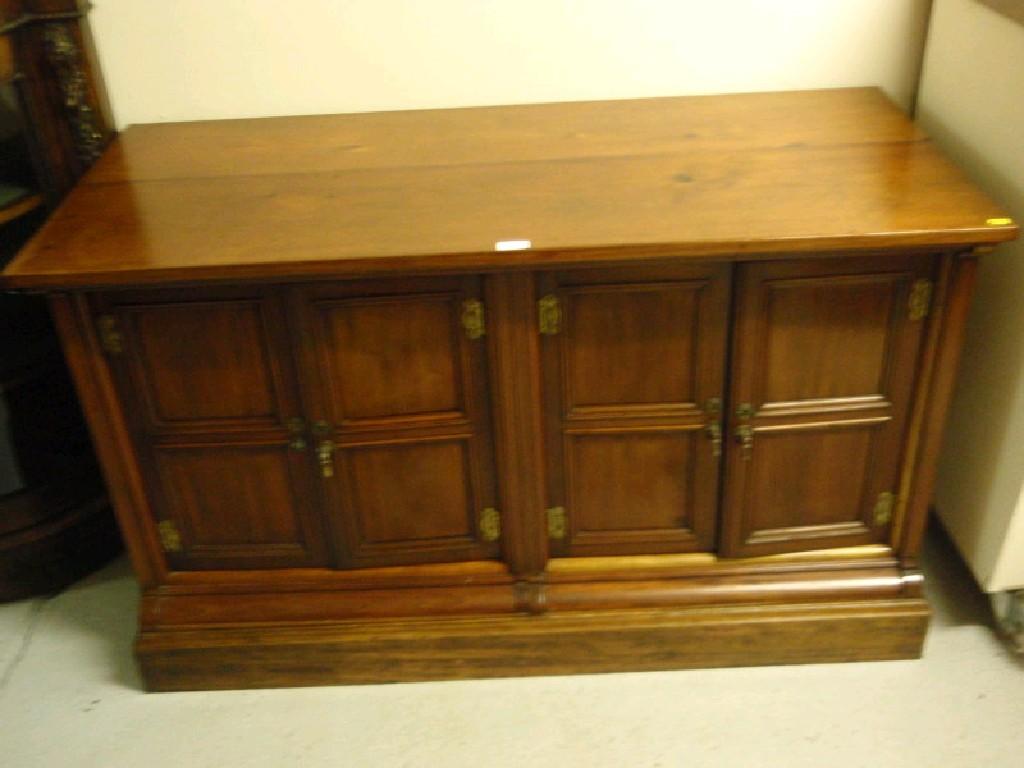 Appraisal: A Victorian walnut cabinet base on plinth converted to a