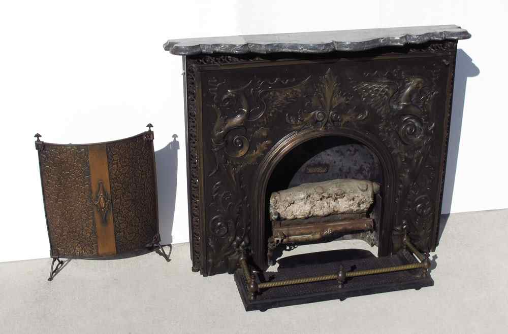 Appraisal: ORNATE DRAGON DESIGN CAST IRON FIRE PLACE SURROUND Cast iron