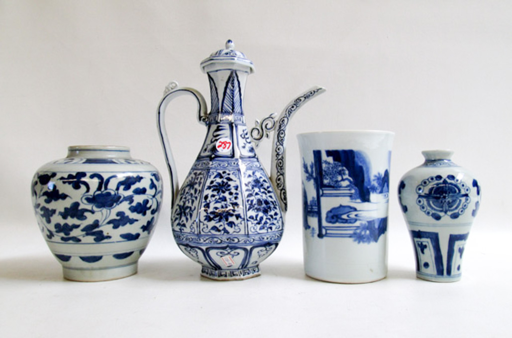 Appraisal: FOUR PIECES OF ASIAN POTTERY consisting of a wine ewer