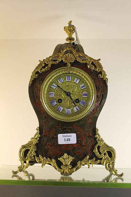 Appraisal: A BOULLE LOUIS XV STYLE MANTEL CLOCK with white enamelled