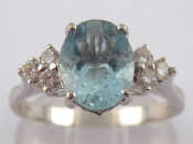 Appraisal: A white metal tests carat gold aquamarine and diamond ring