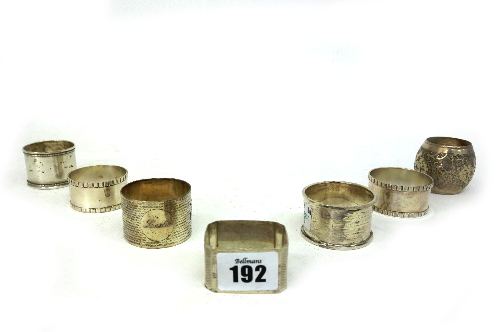 Appraisal: Two engine turned silver napkin rings Birmingham another silver napkin